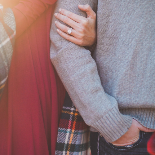 Couple linking arms