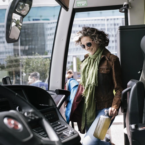 Woman walking onto coach