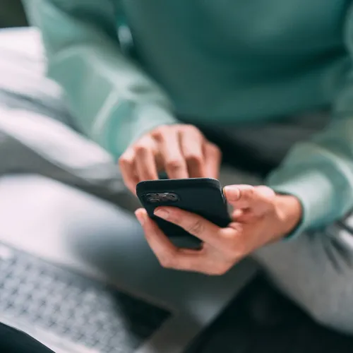 Person tapping on a smart phone