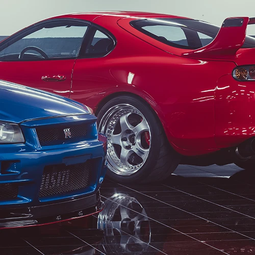 two Japanese import cars side by side